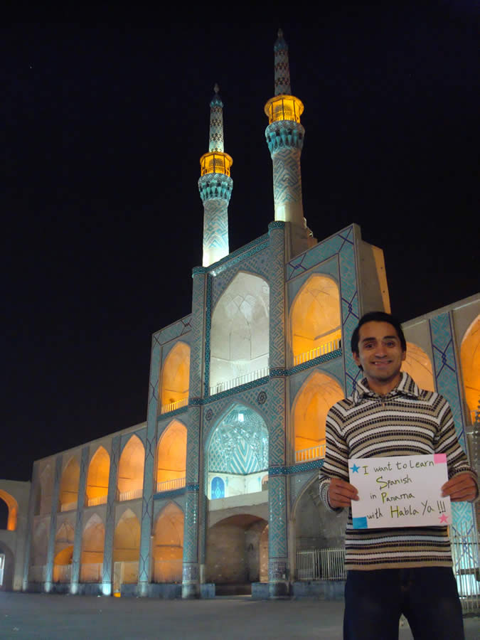Javad from Yazd, Iran, sent us this photo: the building behind me is a prominent structure at the middle of the city center square. It's around 400 years old and it's a symbol of the city.